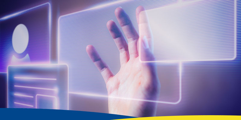Mão de mulher tocando uma interface holográfica